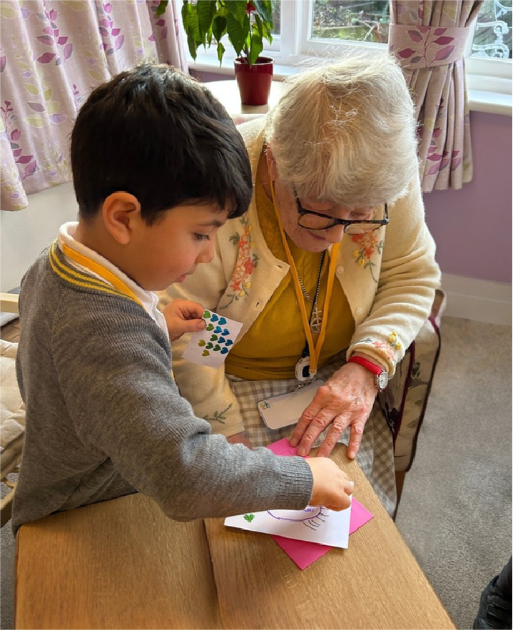 An older adult and child working together