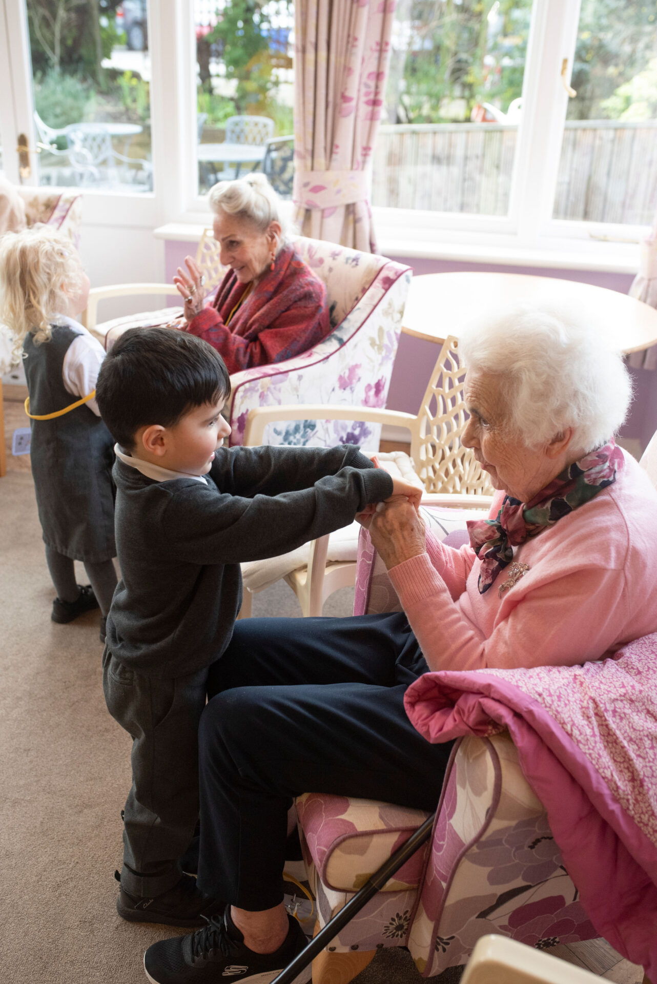 An older adult and child connecting